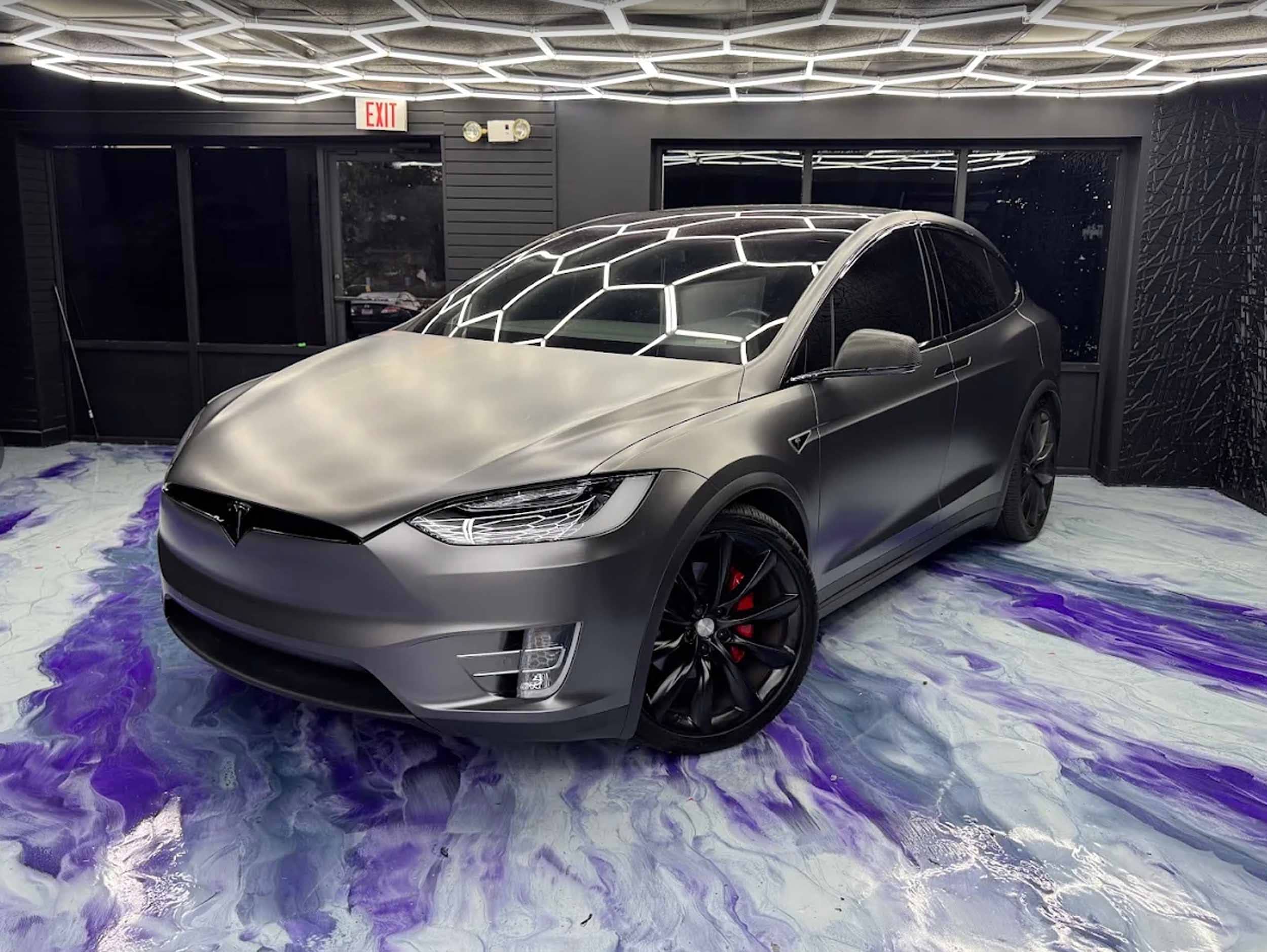 Tesla Model X with finished side window tint inside the studio